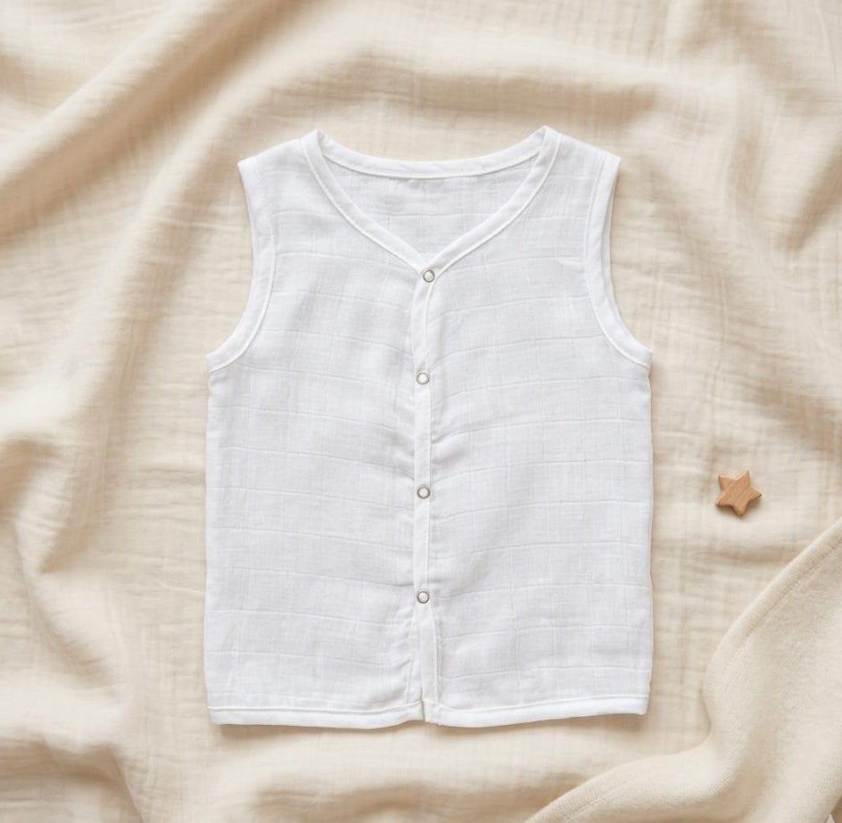 White sleeveless shirt on a beige fabric background