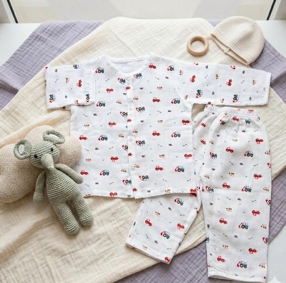 Baby outfit with car pattern on a textured surface