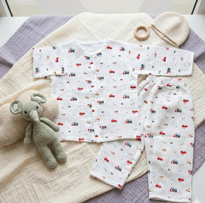 Baby outfit with car pattern on a textured surface