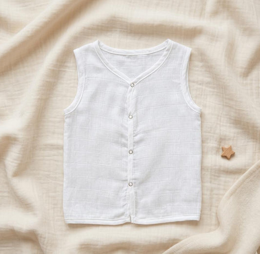 White sleeveless shirt on a beige fabric background